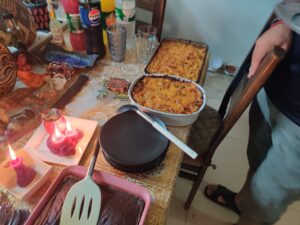 macaroni and cheese and a chocolate cake on the altar and table