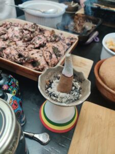 Incense cone half burnt, and chicken for the event